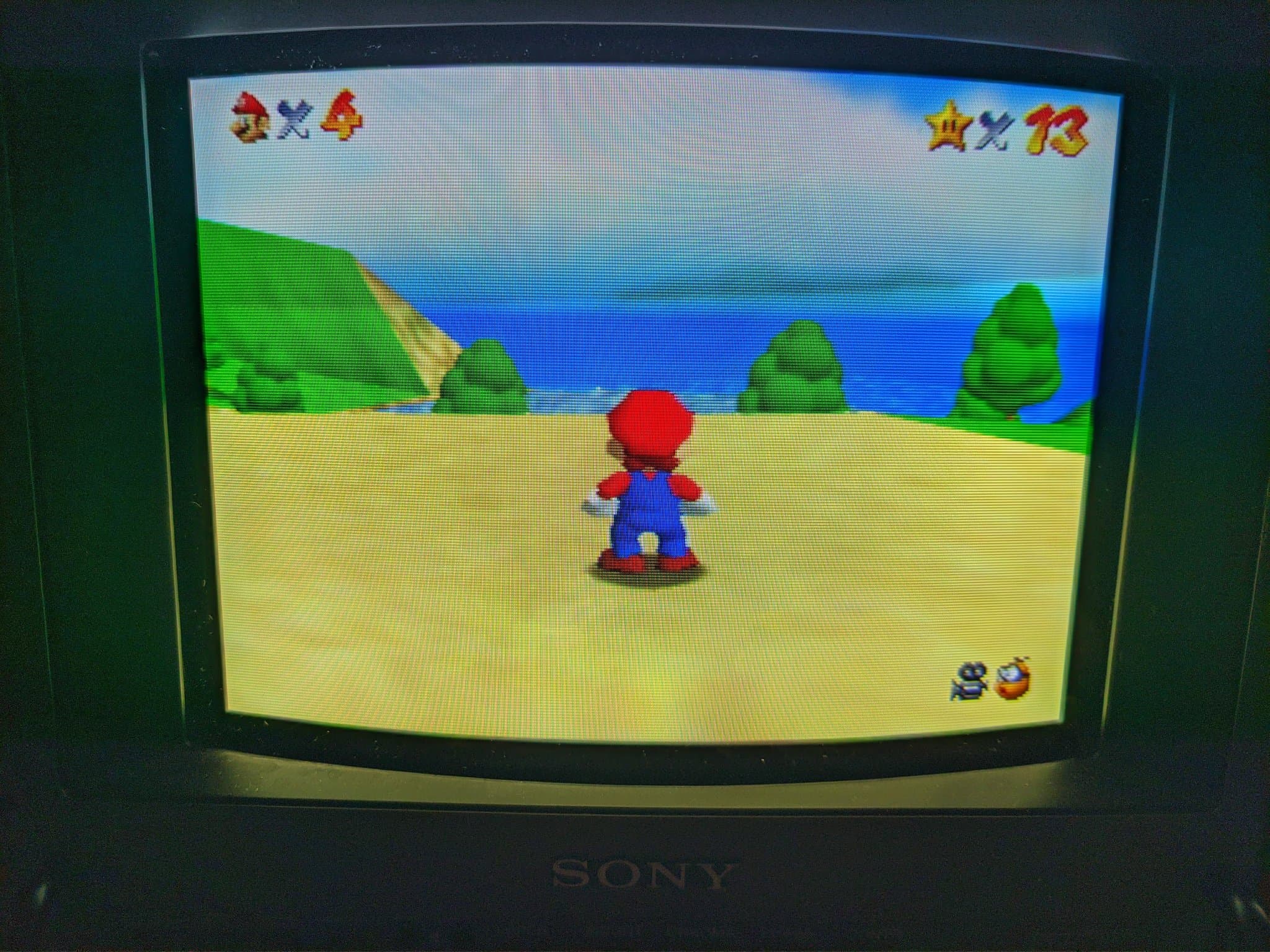Sony BVM-9045QD displaying Super Mario Bros after restoration; red color channel previously missing due to broken neckboard solder joint.