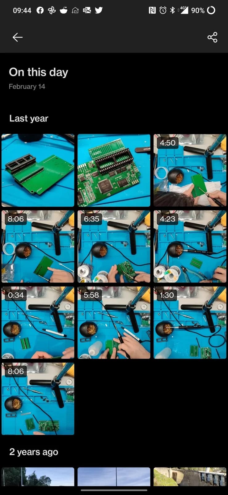 Phone screenshot of a Feb-14 'On this day' photo-memories collage from the NESRGB install on the Sharp Twin Famicom, a grid of stills and short clips showing the various stages of assembling the NESRGB kit: green boards, a soldering iron and hands working on a blue mat.