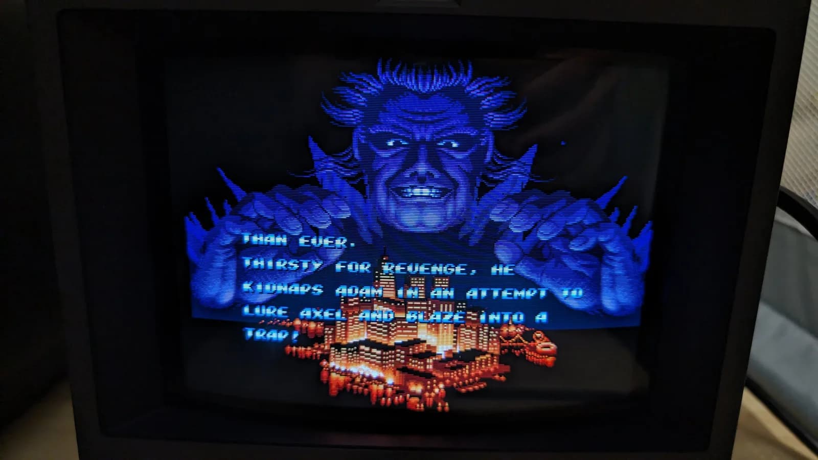The Streets of Rage 2 intro on the Sony PVM-9045QD on arrival day, a night city skyline lit up with bloom from the bright light sources, confirming the monitor worked before any restoration.