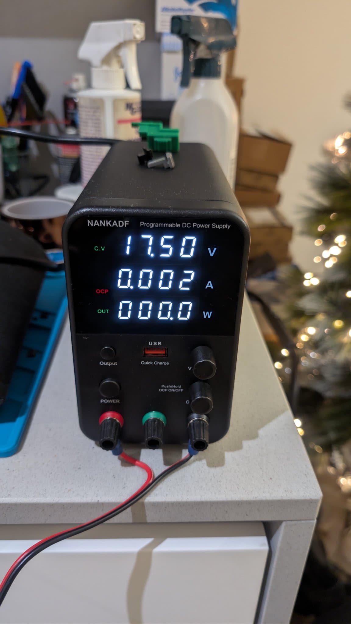 NANKADF programmable DC bench power supply reading 17.50 V, 0.002 A, 0.0 W while applying voltage to the PC Engine LT's LCD bias pin to test the screen.
