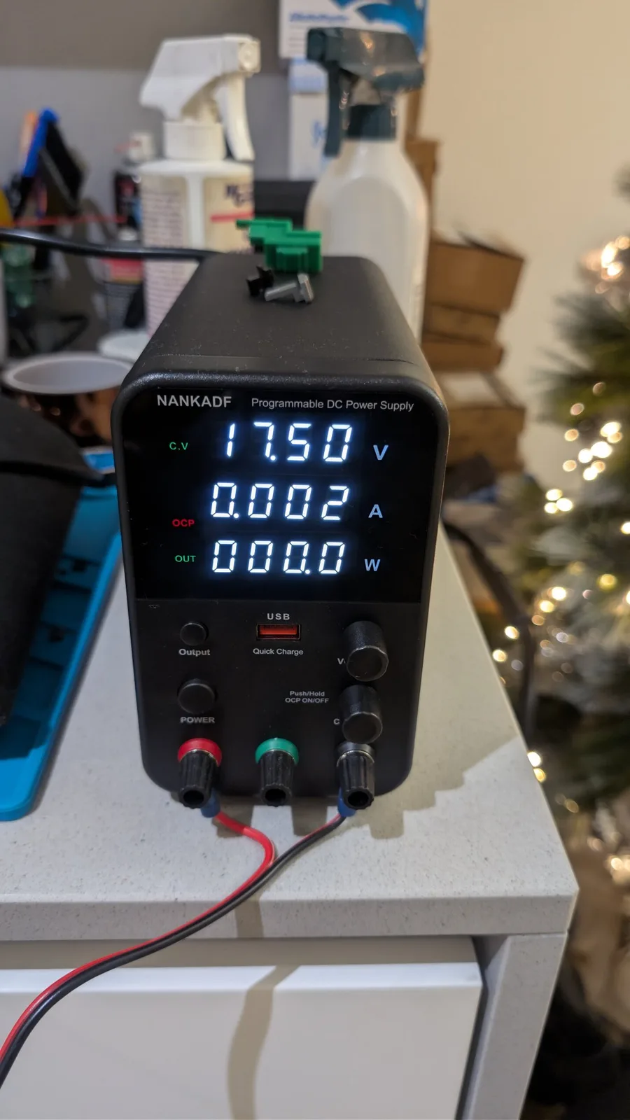 NANKADF programmable DC bench power supply reading 17.50 V, 0.002 A, 0.0 W while applying voltage to the PC Engine LT's LCD bias pin to test the screen.