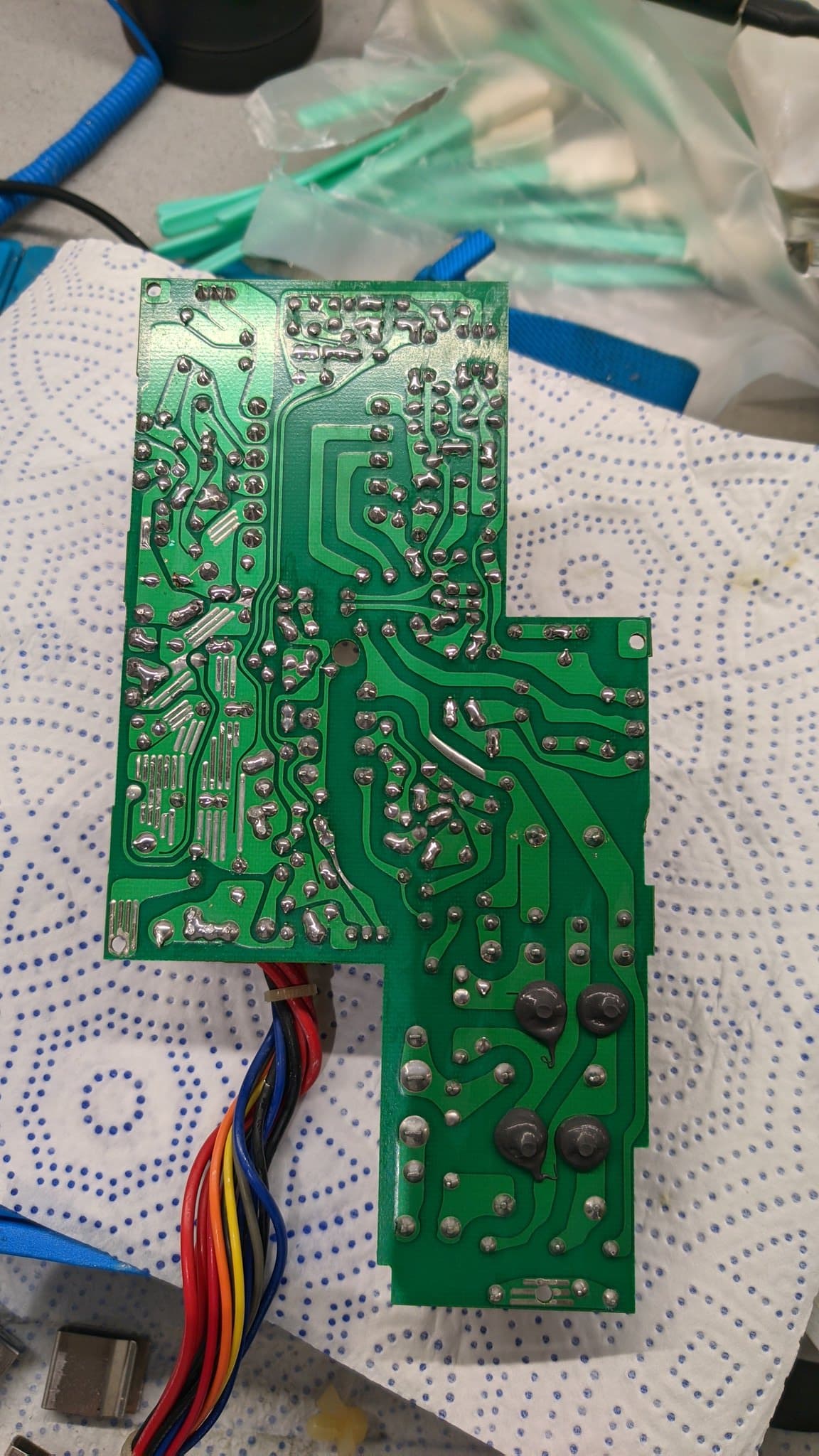 The underside of the Sharp X68000 Pro II power supply PCB, spotless after cleaning, its solder joints freshly reflowed and gleaming.
