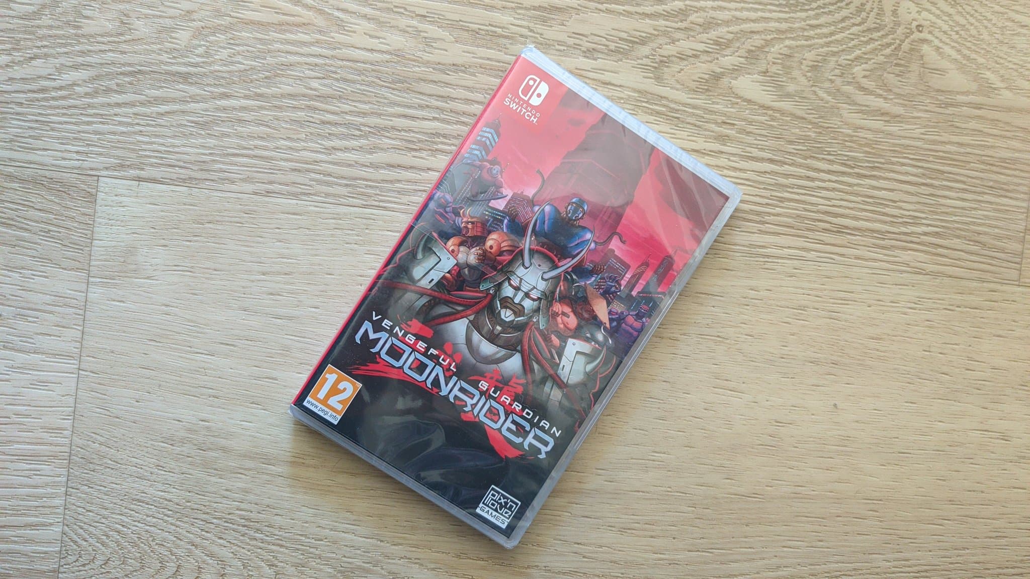Nintendo Switch game case for Vengeful Guardian: Moonrider on wooden surface, unrelated to CRT monitor repair.
