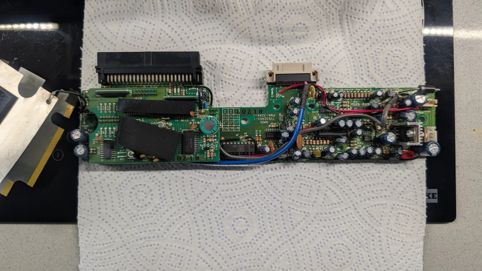 NEC IFU-30 mainboard before the recap, with its original capacitors still in place.
