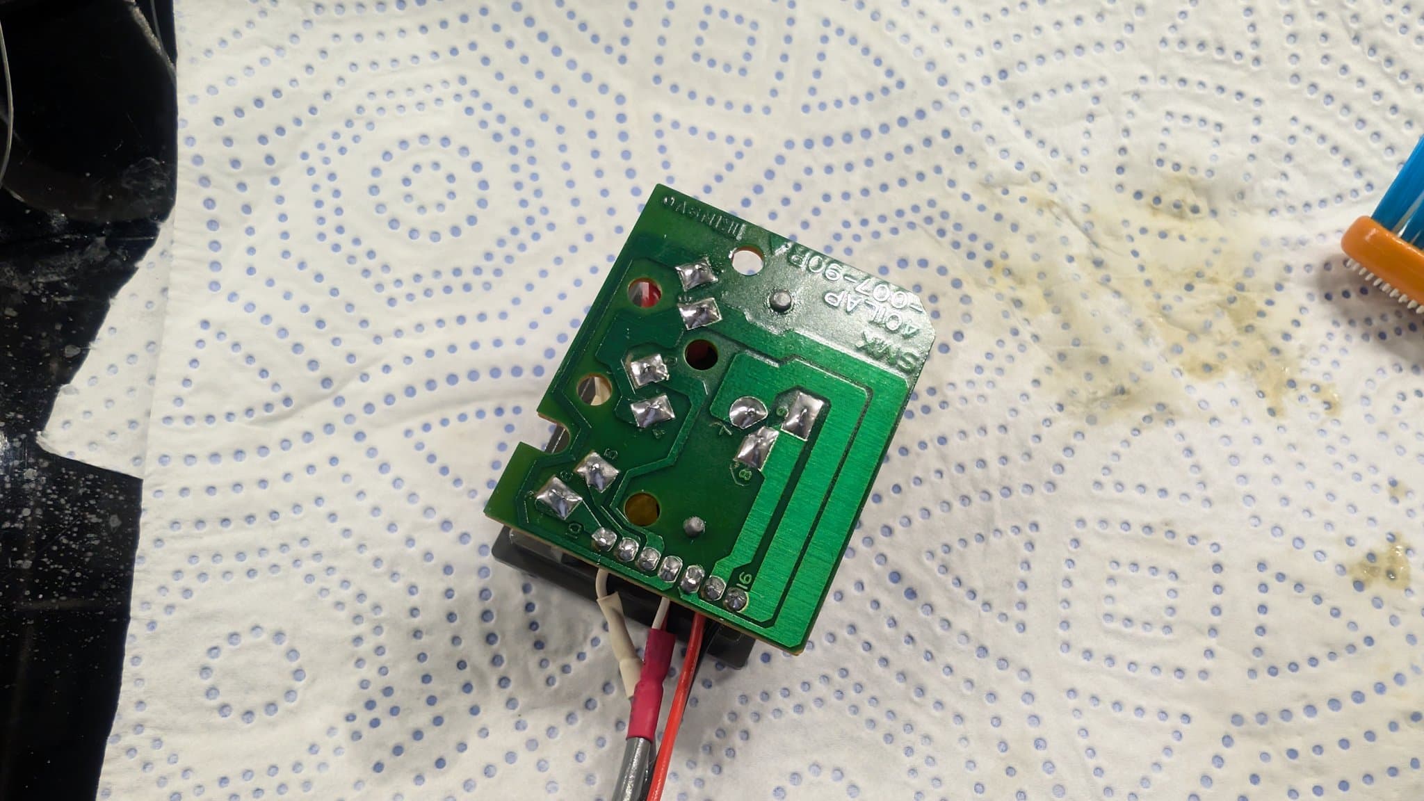 Underside of the NEC IFU-30's power and AV input board, the RCA and power jack pins reflowed.