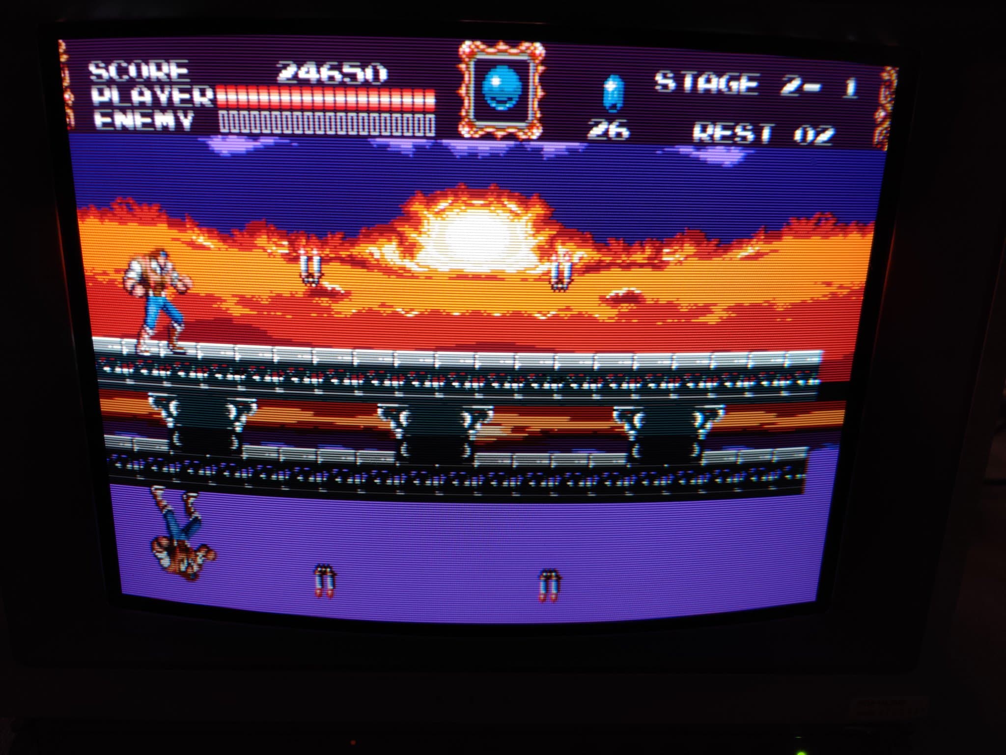 Sony PVM-14L2 displaying Castlevania gameplay; neck board recapping and anode cap maintenance in progress on professional monitor.