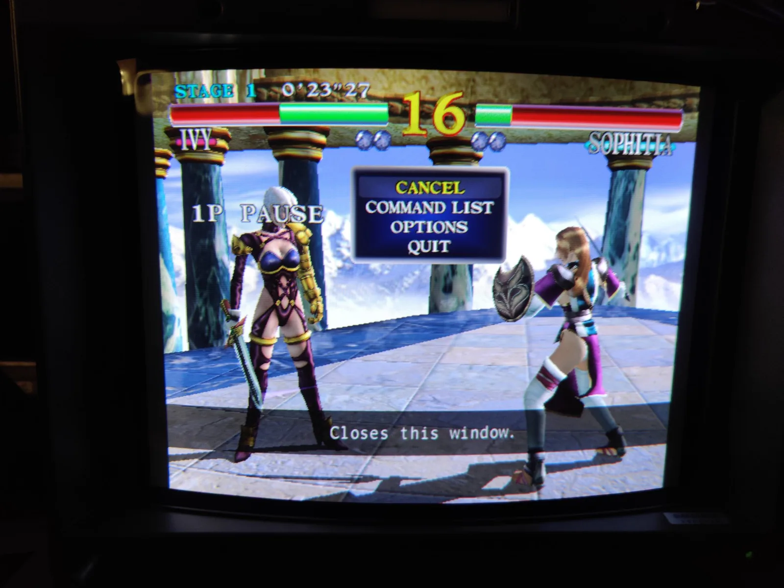 Soulcalibur (the Dreamcast port) paused on the Sony BVM-D14H1E, Ivy versus Sophitia on the Stage 1 arena, the in-game pause menu (Cancel, Command List, Options, Quit) overlaid. It is running at 480p from the Dreamcast through the DC2VGA dongle and the Extron RGB 109xi, the setup that fixes the Dreamcast 480p sync issue on this BVM.