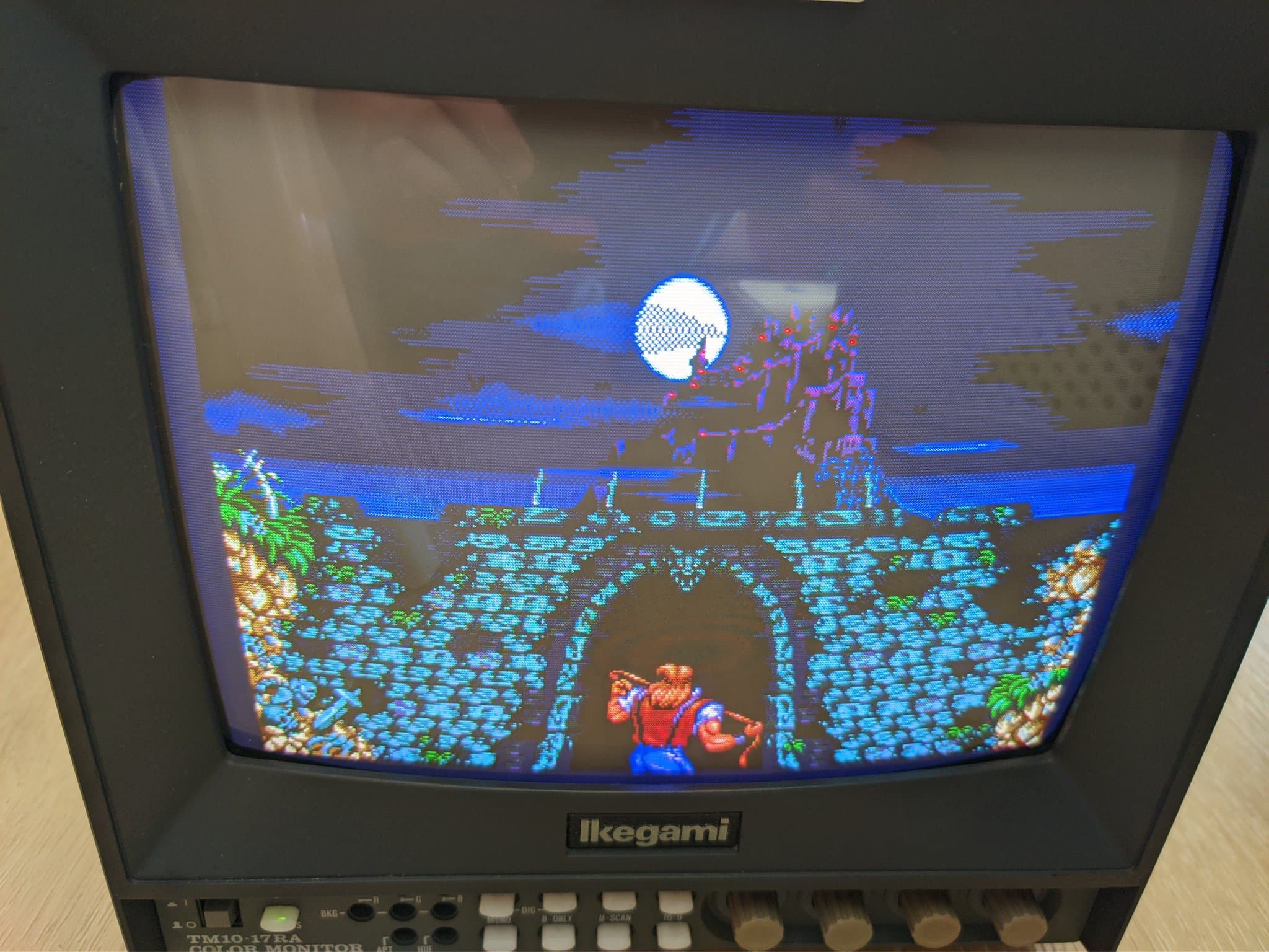 Ikegami TM10-17RA CRT running Castlevania: Bloodlines (Vampire Killer), a moonlit stage with stone ruins over water, after the voltage conversion.