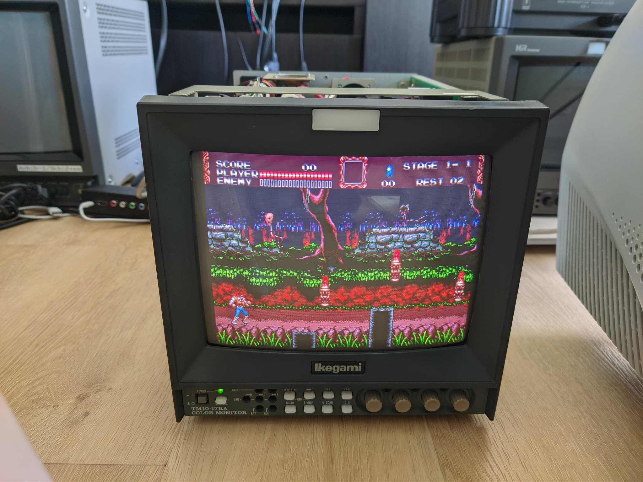 Ikegami TM10-17RA CRT showing Vampire Killer (Castlevania: Bloodlines) at Stage 1-1, HUD reading SCORE, PLAYER, ENEMY, REST, after the voltage conversion.