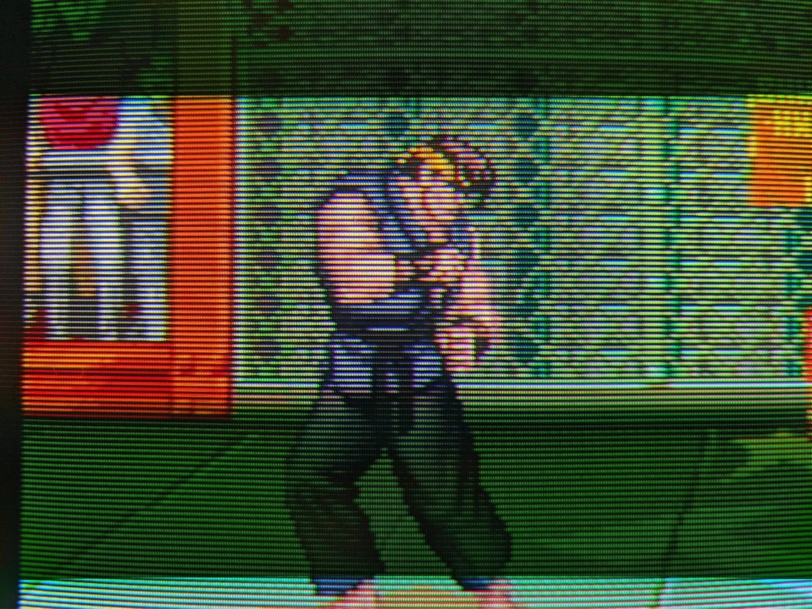 Extreme close-up of the Sony BVM-D14H1E screen, the RGB phosphor stripes and scanlines resolving a Street Fighter II fighter, run from a 3DO over S-video at 240p (the 3DO's OEM 240p/480i toggle set to 240p) through the BKM-127W.