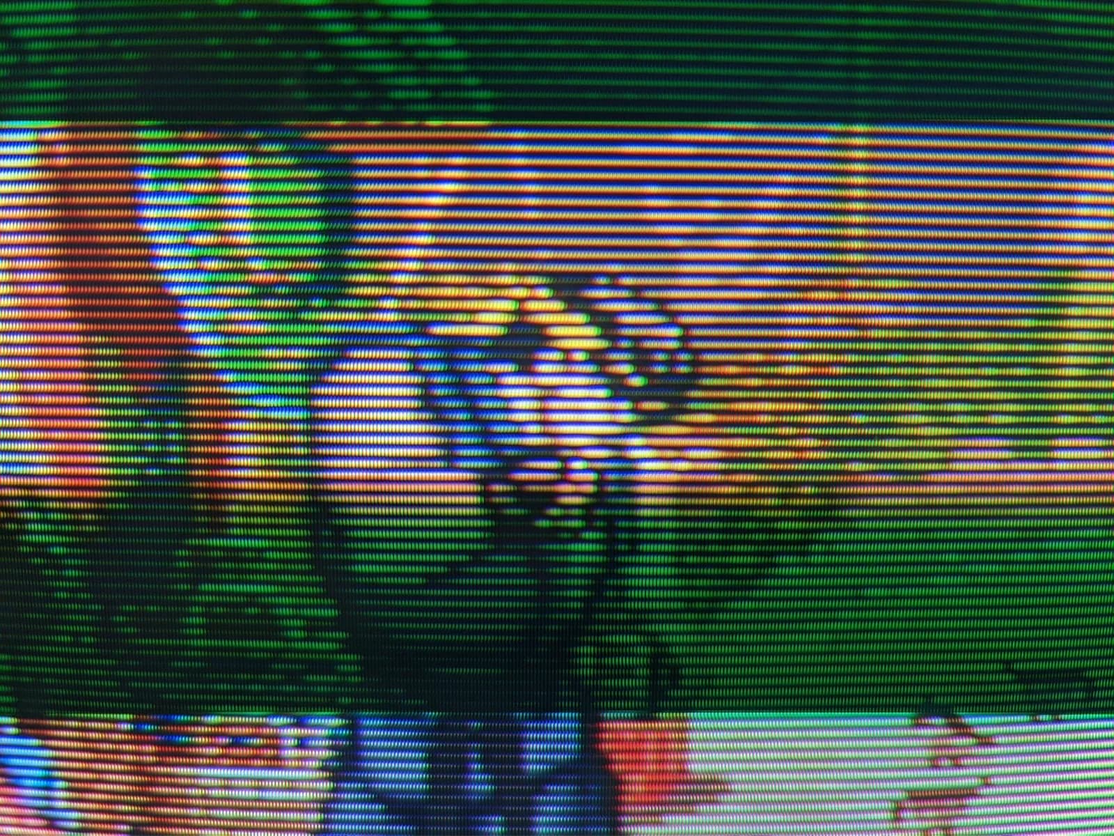 Extreme close-up of the Sony BVM-D14H1E screen, the RGB phosphor stripes and scanlines making up a Street Fighter II character, run from a 3DO over S-video at 240p through the BKM-127W.
