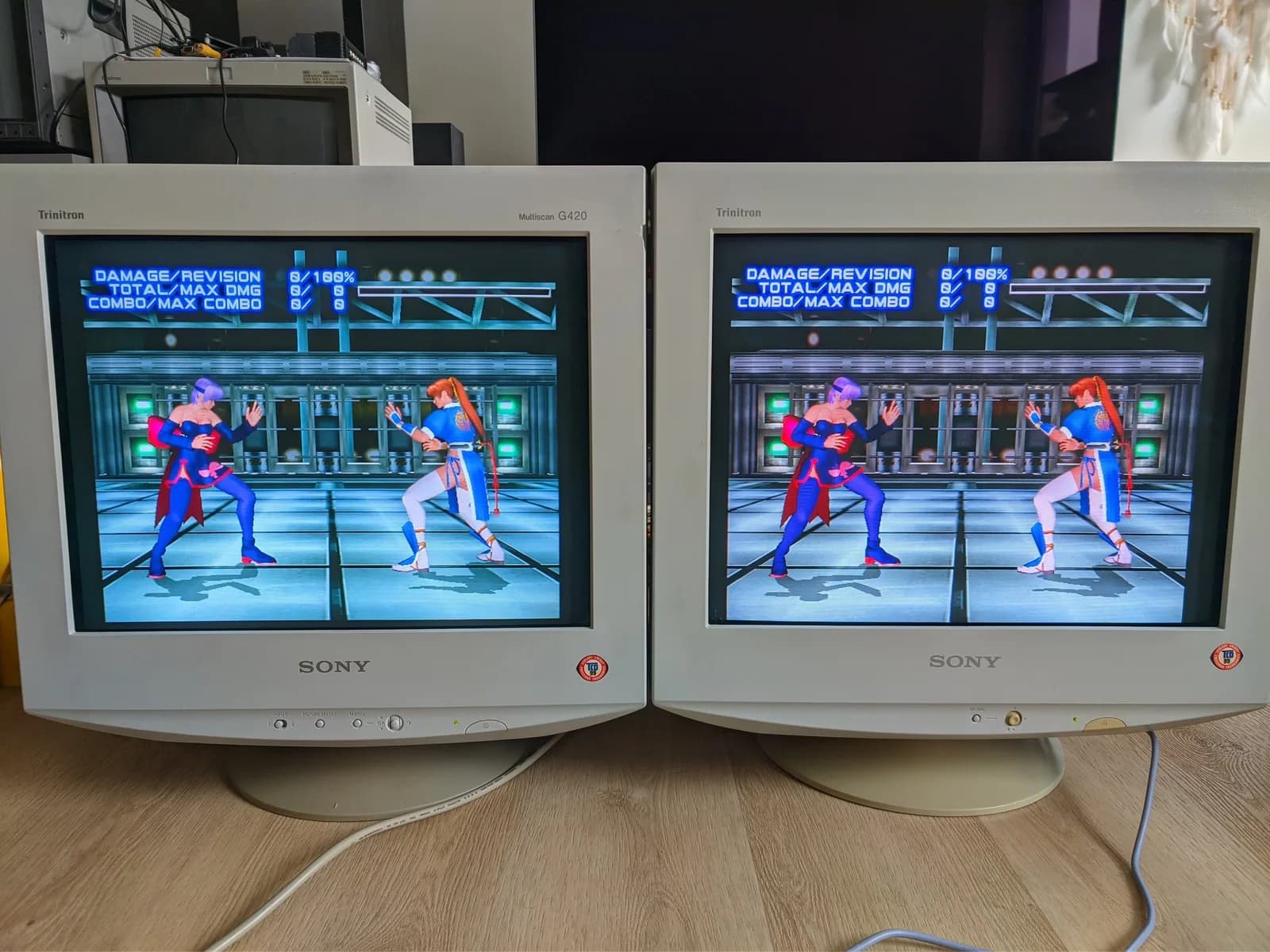 Sony CPD-G420 and CPD-E430 side by side, both running Dead or Alive 2, for a color-calibration comparison after the repair.