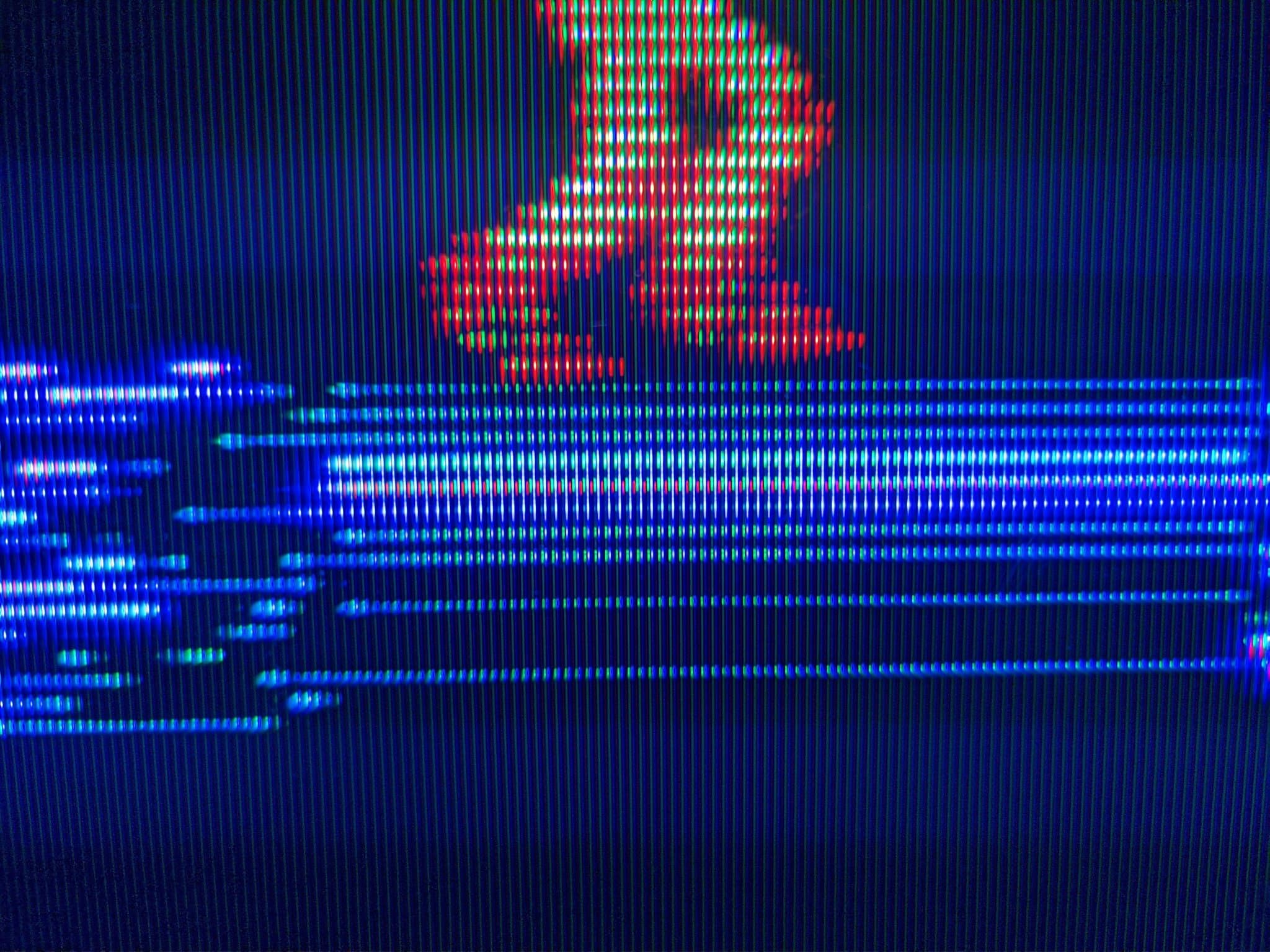 Famicom composite video test on Sony KV-29FX30E displaying Metroid title screen with red/orange sprite against blue scanlines.