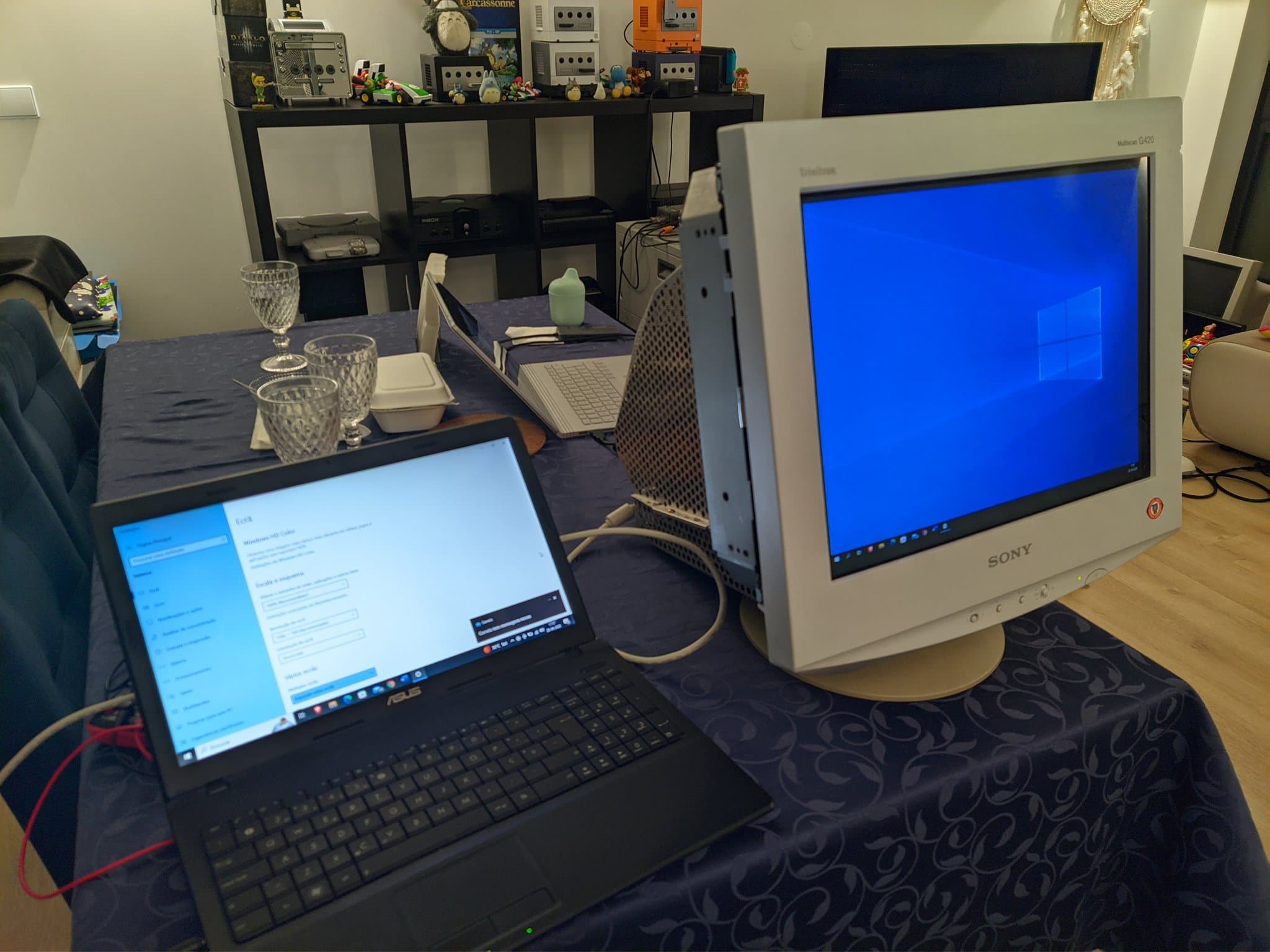 The repaired Sony CPD-G420 showing the Windows 10 desktop, beside a laptop open to Windows display settings, after the G2 calibration.