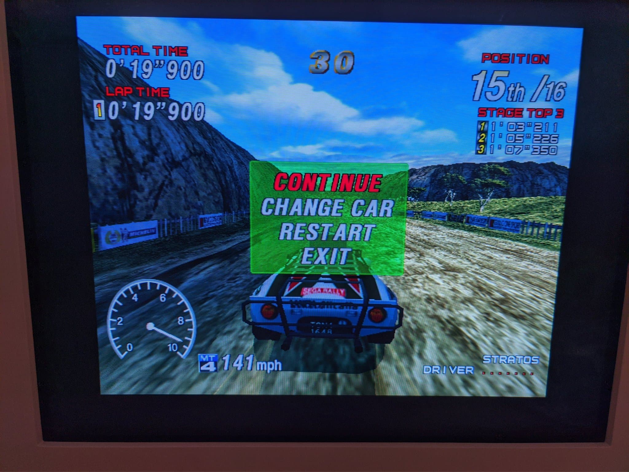 Sega Rally 2 paused on the repaired Sony CPD-G420, the green Continue menu over the race, corrected geometry after the G2 calibration.