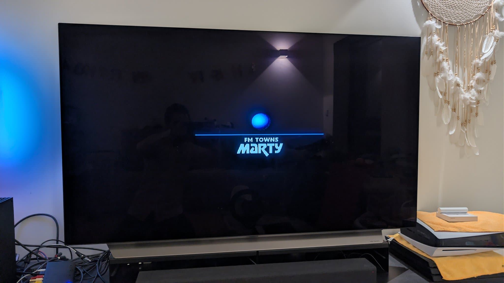 FM Towns Marty startup screen displaying blue "FM TOWNS marty" text on black background, indicating successful boot after restoration.