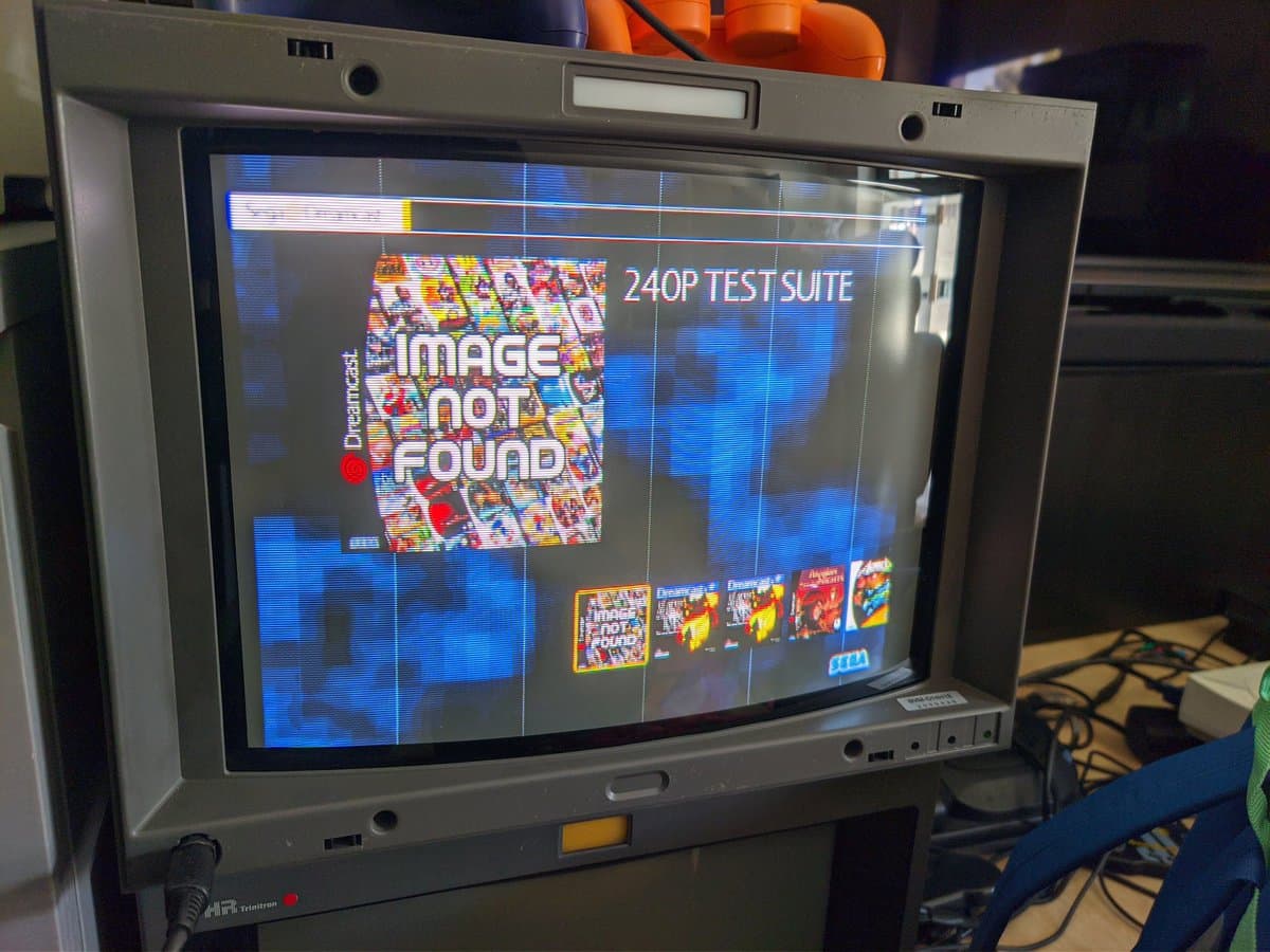 Sony BVM-D14H1E displaying 240p test suite with Dreamcast output; professional CRT monitor showing color convergence and scanline patterns.
