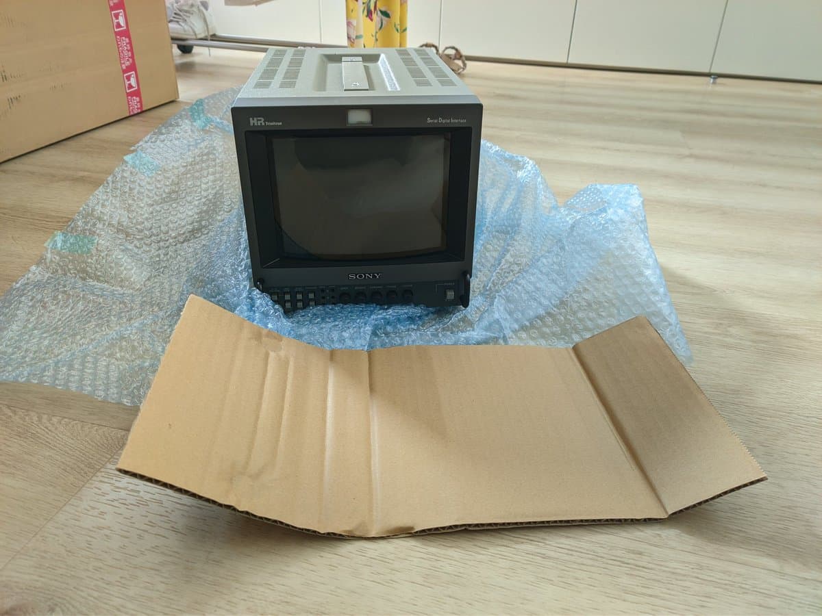Sony BVM-9045QD monitor unboxed with bubble wrap, arriving from Japan for CRT restoration work.