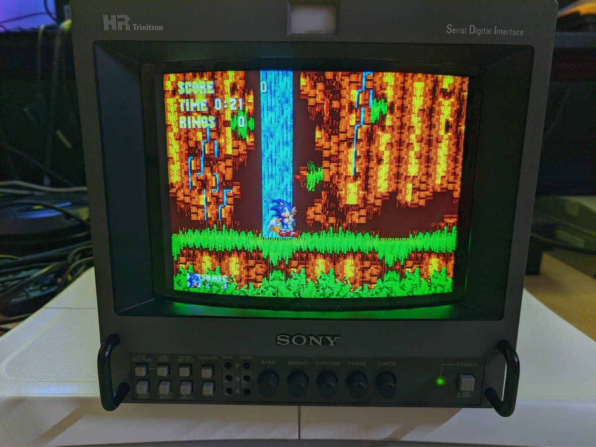 Sony BVM-9045QD displaying Sonic the Hedgehog with restored color output; neckboard solder joint reflowed during restoration.