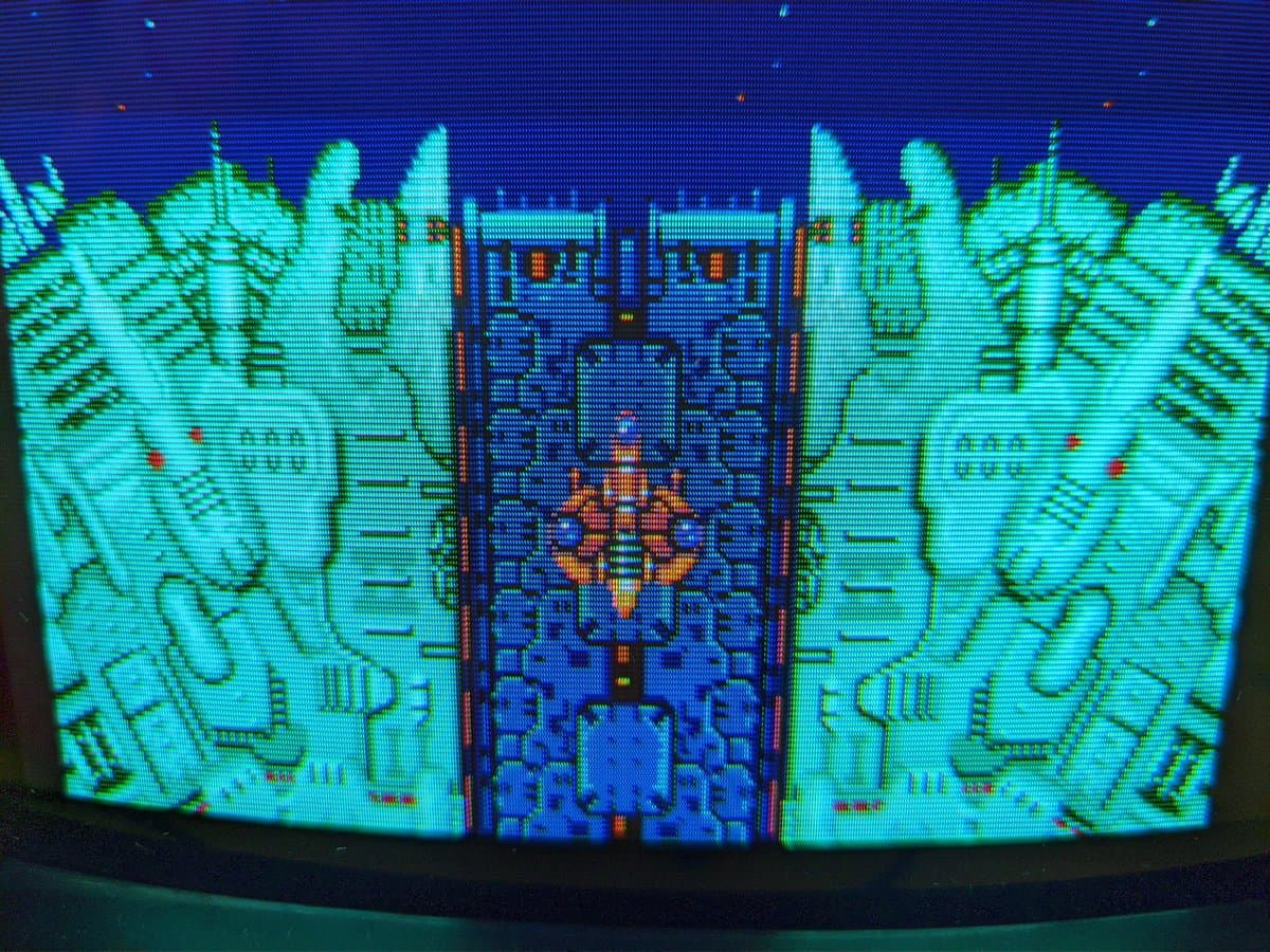 Sony BVM-9045QD displaying Super Metroid and Truxton gameplay after full restoration with vibrant cyan and magenta colors restored.