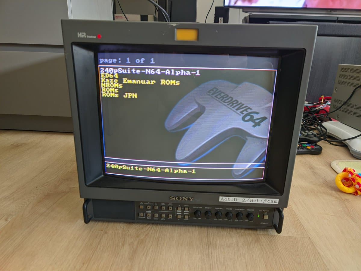 Sony PVM-14M4J displaying N64 boot screen after repair; retrace lines issue and color channel problem resolved.