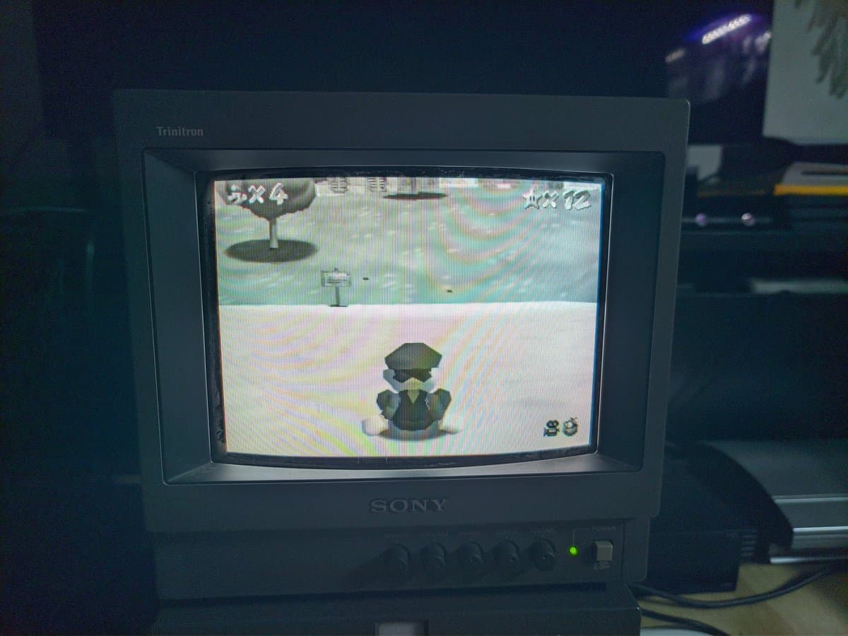 Sony PVM-9040 displaying Super Mario 64 gameplay; 250TVL monitor showing crisp image quality with character and environmental details clearly visible.