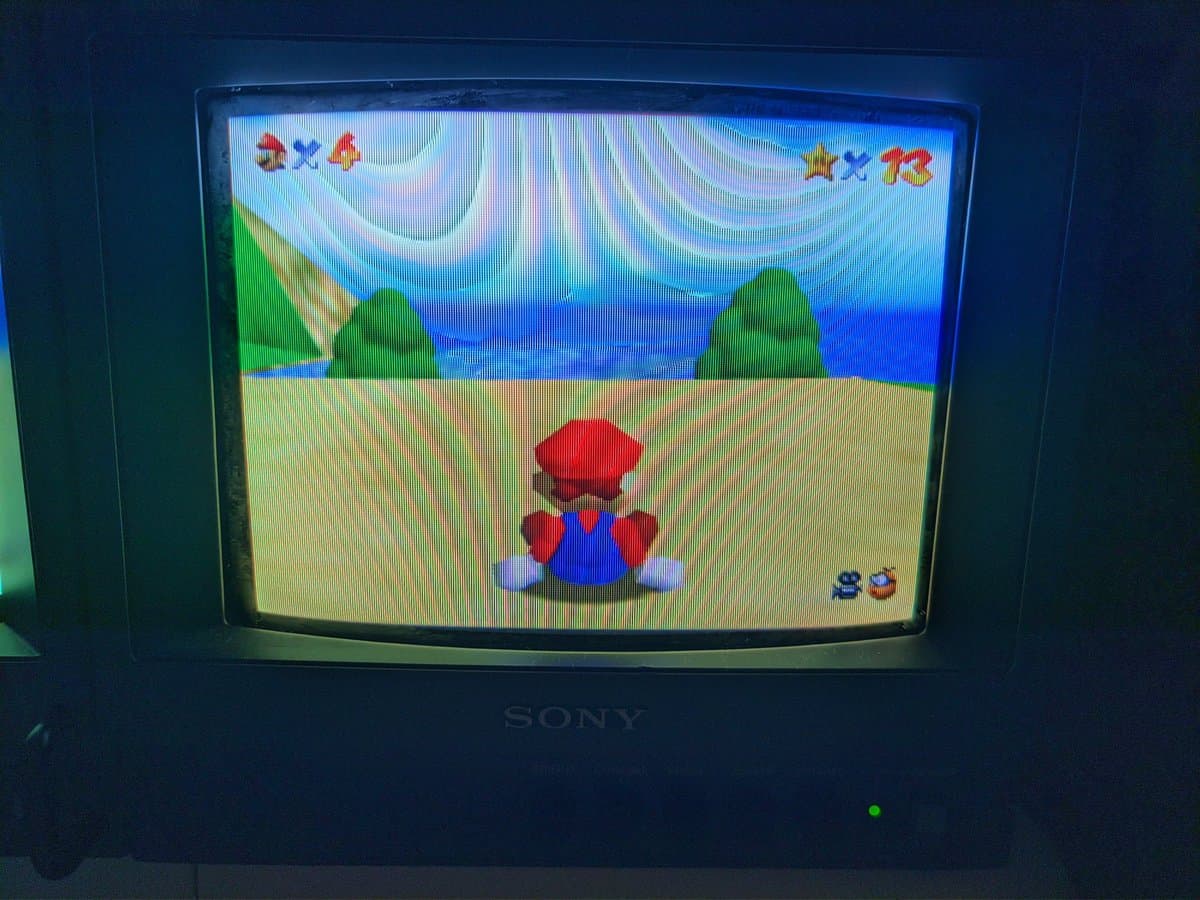 Sony BVM-9045QD displaying Super Mario Bros test pattern after restoration; red channel previously missing from neckboard solder joint repair.