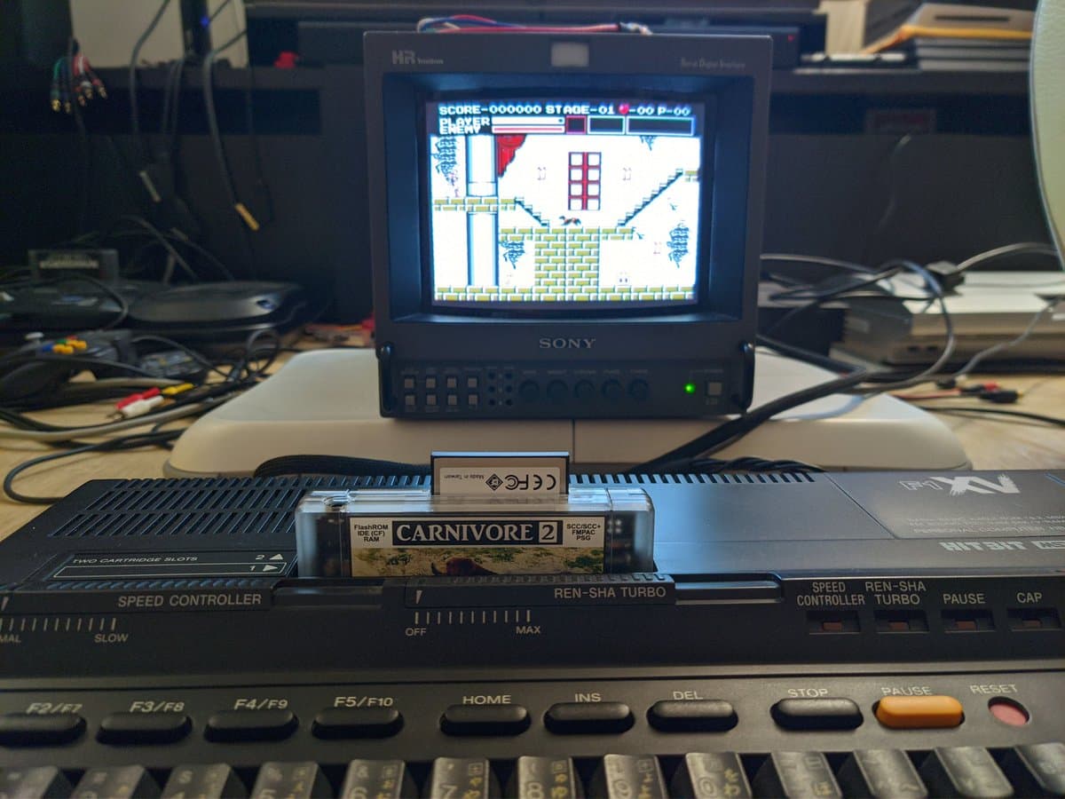 Sony MSX2+ with Carnivore 2 cartridge inserted, displaying Castlevania on composite-connected CRT monitor during restoration testing.