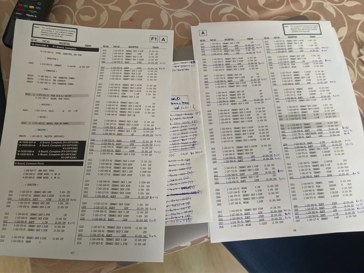 Schematic pages and parts lists for Sony KV-29FX30E with handwritten notes marking capacitor values and measurements during restoration planning.