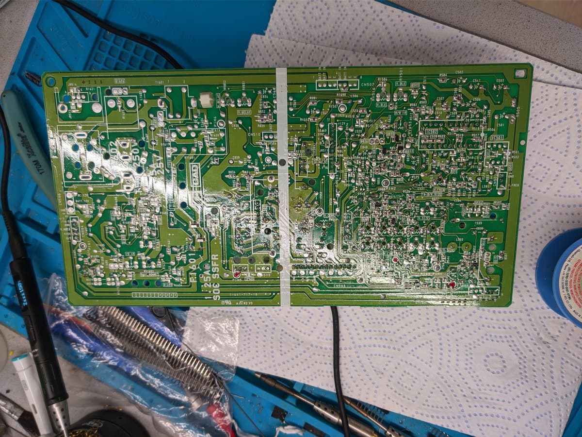 Deflection board from Sony PVM-9040 #1 with visible corrosion and oxidation on components; recap maintenance in progress.