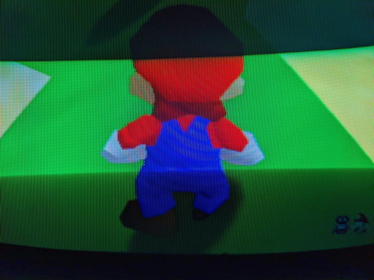 Mario character viewed on Sony PVM-9040 CRT via S-video connection, displaying vibrant reds, blues, and greens with scanline pattern visible.