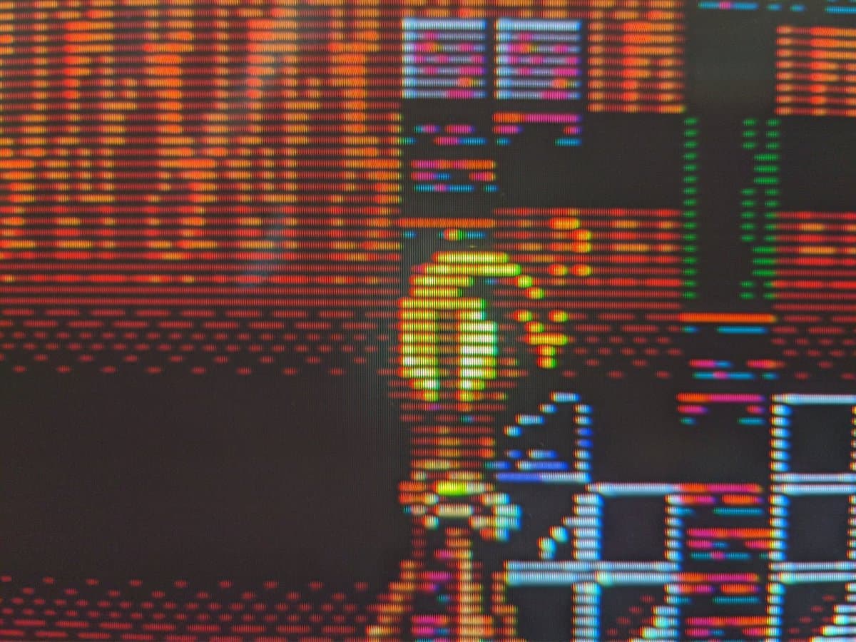 Colorful waveform patterns displayed on Sony CPD-E430 CRT monitor screen showing red, orange, yellow, blue, cyan, magenta and green signal bars.