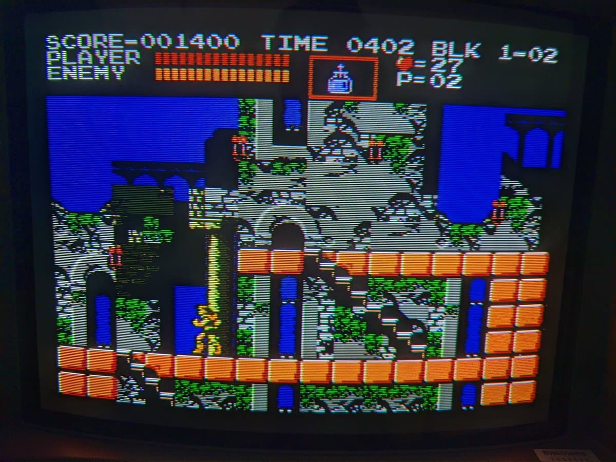 Castlevania on Famicom displaying on Sony BVM-D14H1E via composite input; HUD shows score, time, health bars, and player/enemy status.