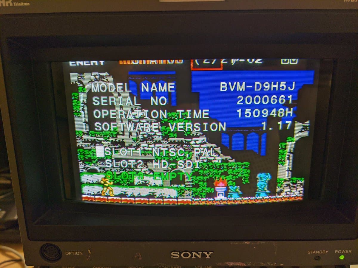 Sony BVM-D9H5J service menu displaying model info, serial 2000661, 150948 operation hours, software v1.17, with Castlevania gameplay visible.