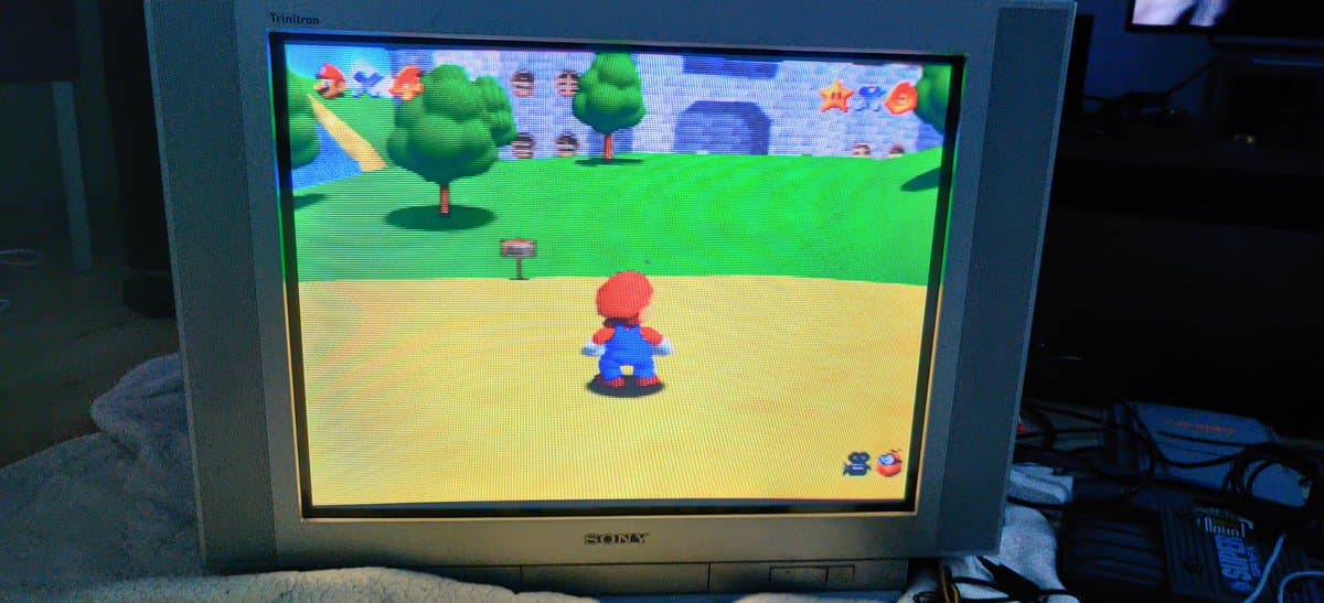 Super Mario 64 running on N64 via RGB output on CRT monitor, displaying vibrant colors from modded RGB amp board installation.
