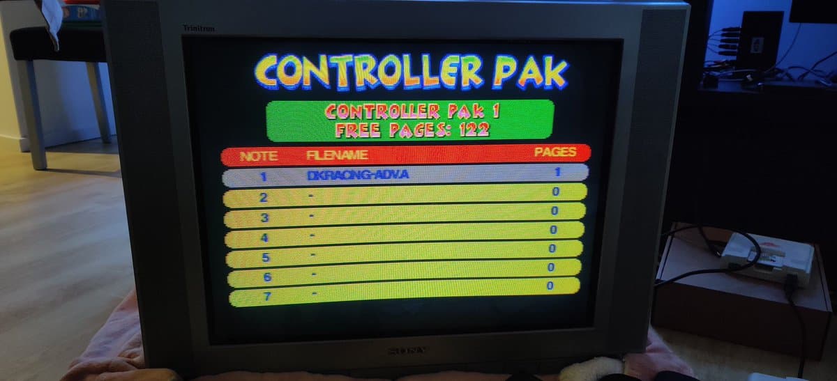 Controller Pak 1 diagnostic screen showing 122 free pages, with seven yellow entry rows displaying 0 pages each, indicating F-RAM upgrade installation complete.