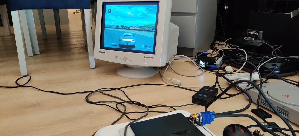 PlayStation 2 connected via Jeff Chen VGA dongle to Samsung CRT monitor displaying Gran Turismo 4 gameplay.