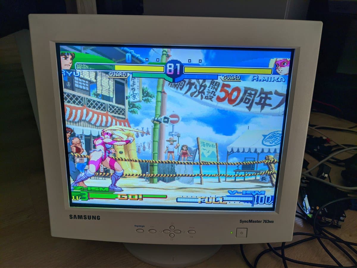 Street Fighter Zero 3 gameplay displayed on Samsung CRT via Jeff Chen VGA dongle, testing dongle compatibility and video output quality.