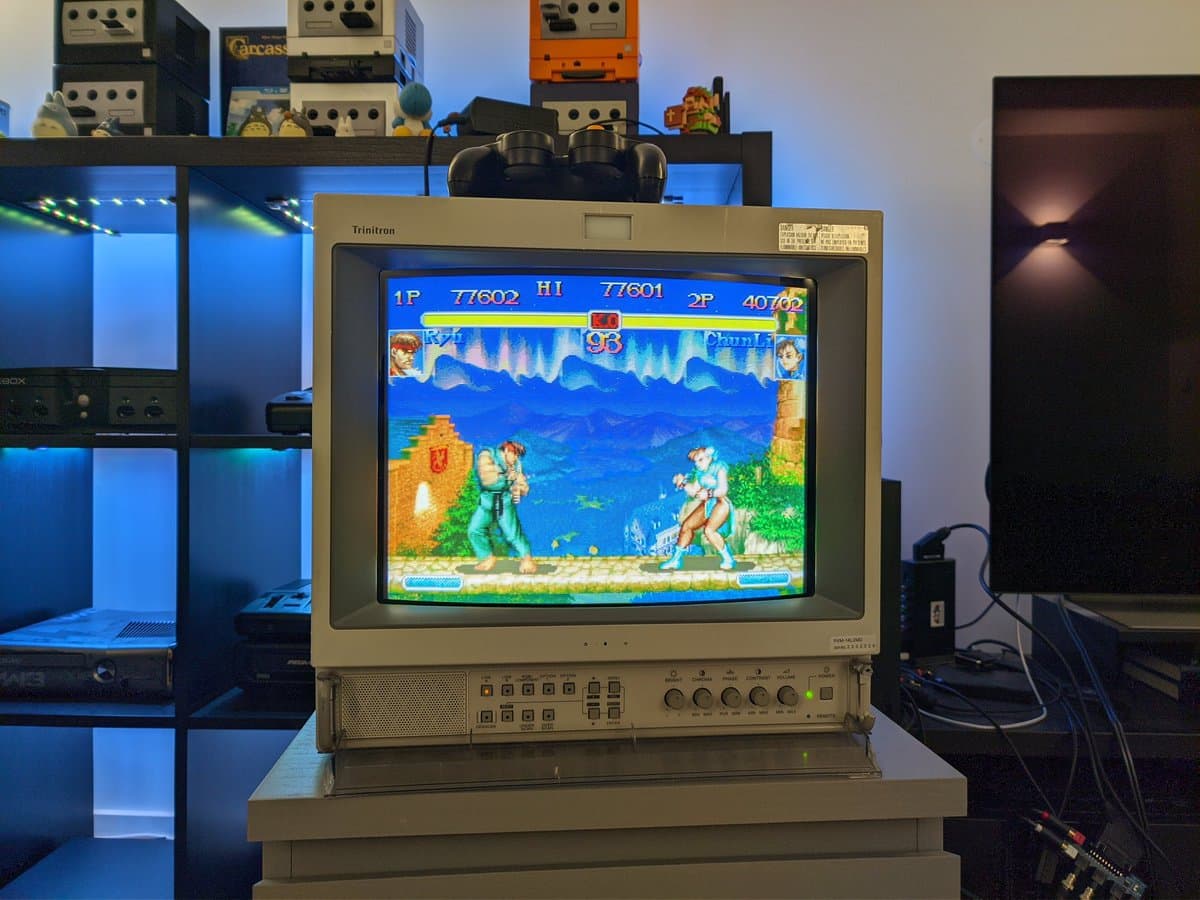 Panasonic Trinitron CRT displaying Street Fighter II Grand Master Challenge arcade game, with 3DO controllers tested post-capacitor replacement.