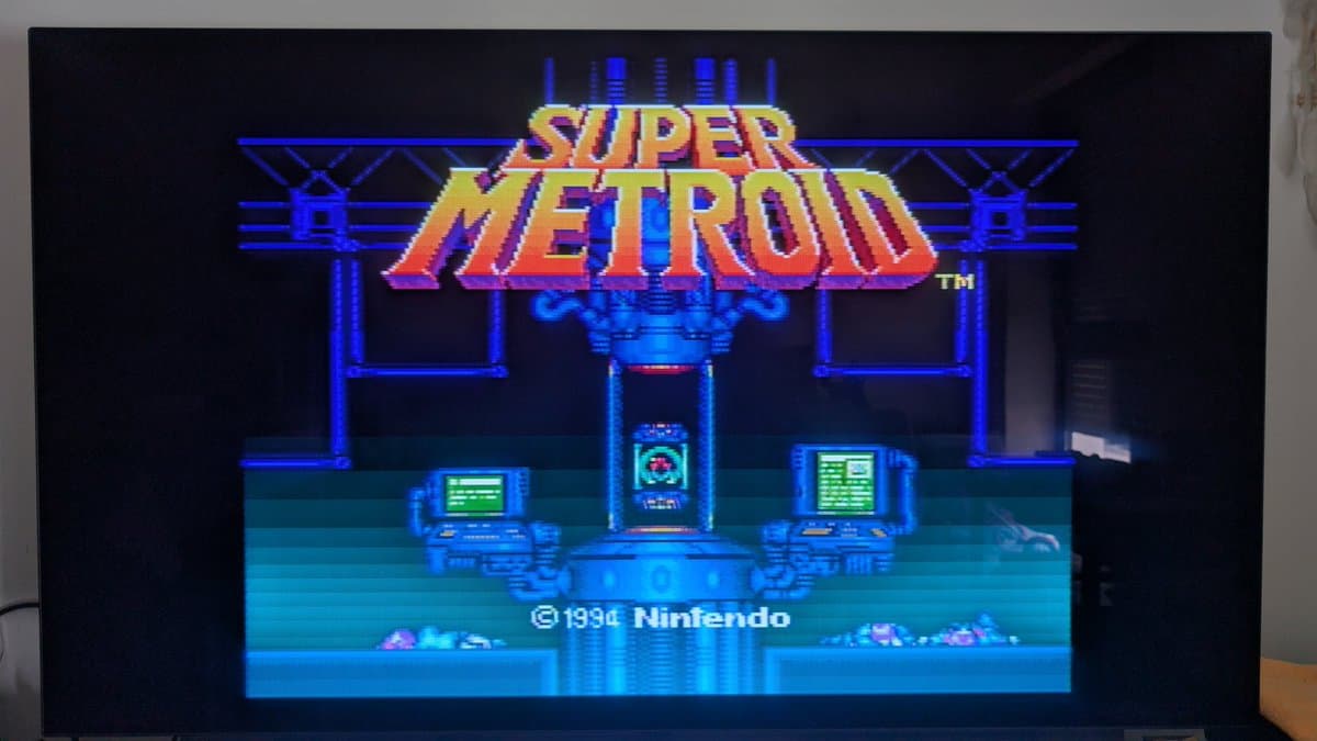 Super Metroid title screen on Tink4K upscaler, displaying composite video cleanup from recapped Super Famicom Jr.