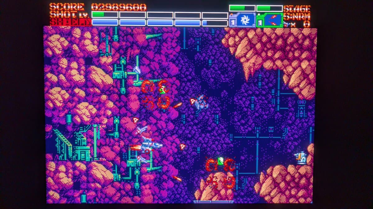 Pixel art shmup gameplay on modded OSSC displaying vibrant magenta/cyan palette with 1440p output, scanlines applied, showing composite color emulation on RGB output.