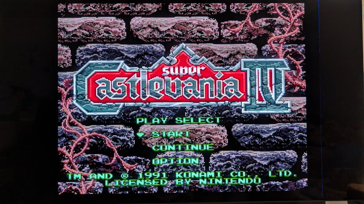Super Castlevania IV title screen displaying on CRT via S-video from recapped Super Famicom Jr., showing vibrant purple castle backdrop.