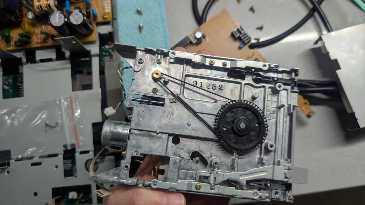 FM Towns Marty floppy drive mechanism showing spindle motor and drive head assembly, part number 31268 visible on metal chassis.