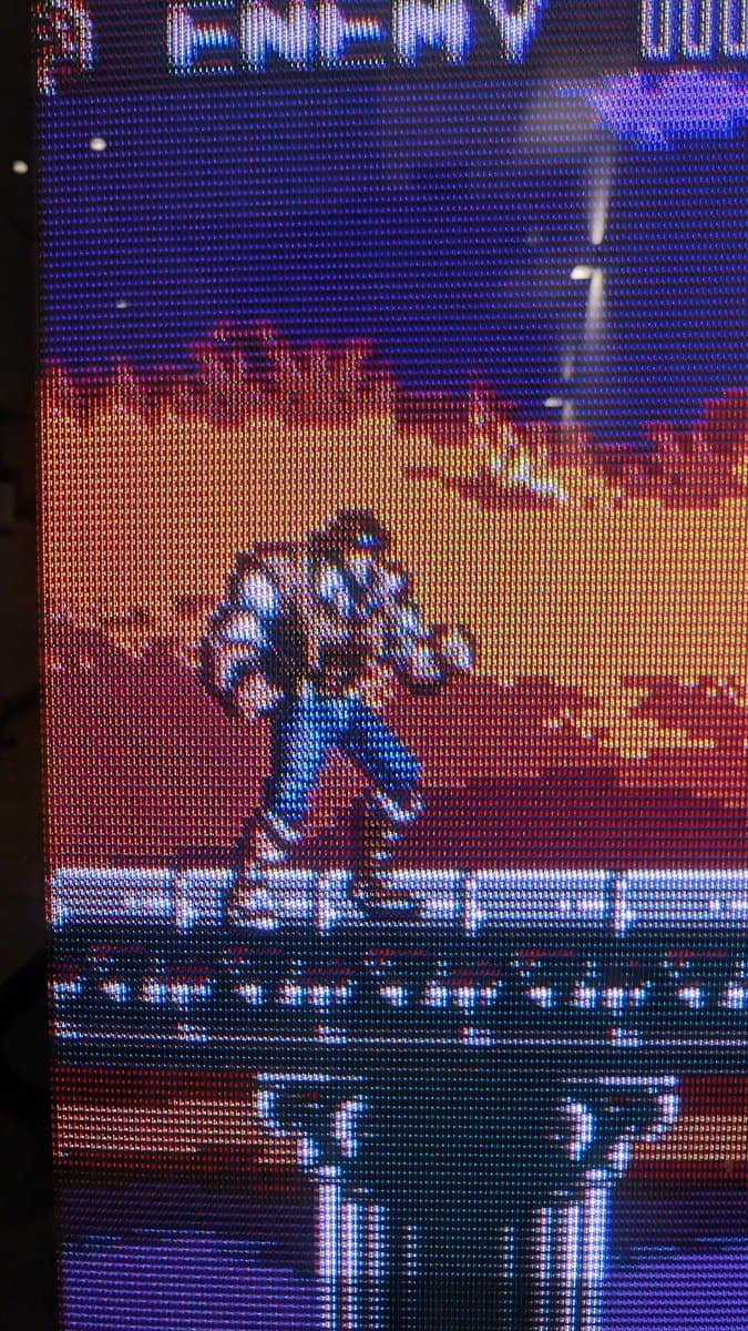 Blown X2 safety capacitor with spectacular damage on B&O Beovision 1 circuit board, charred and burst open.