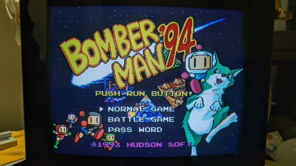 Bomberman '94 title screen on CRT monitor, validating PC Engine IFU-30 recap repair of capacitors and save-data supercapacitor.