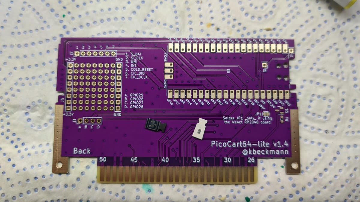 PicoCart64-lite v1.4 PCB back side showing GPIO pins, cartridge connector, and solder joints on breadboard pattern.