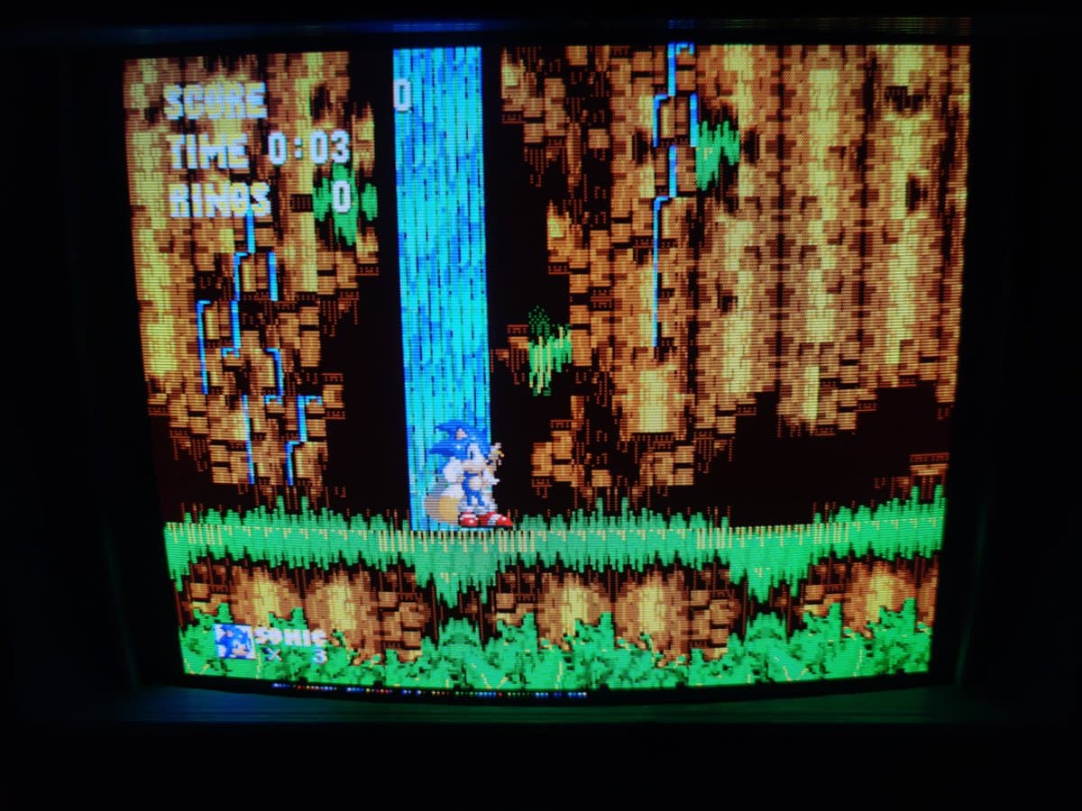 Sonic the Hedgehog displayed on repaired Ikegami HTM-1005RA2 CRT monitor, showing game running at 0:03 time with score visible.