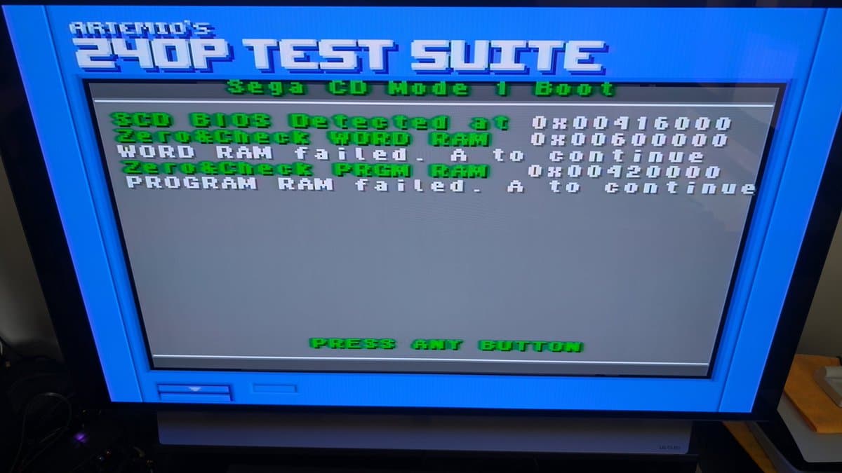 Sega CD Mode 1 boot screen showing SCU BIOS detected, Word RAM failed, Program RAM failed error messages in green text.