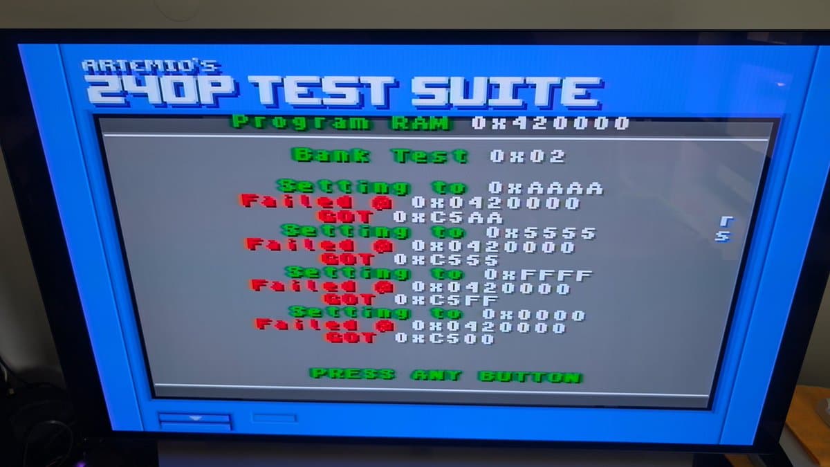 Artemio's 240p Test Suite showing failed Program RAM and WORD RAM tests on Wondermega diagnostic screen.