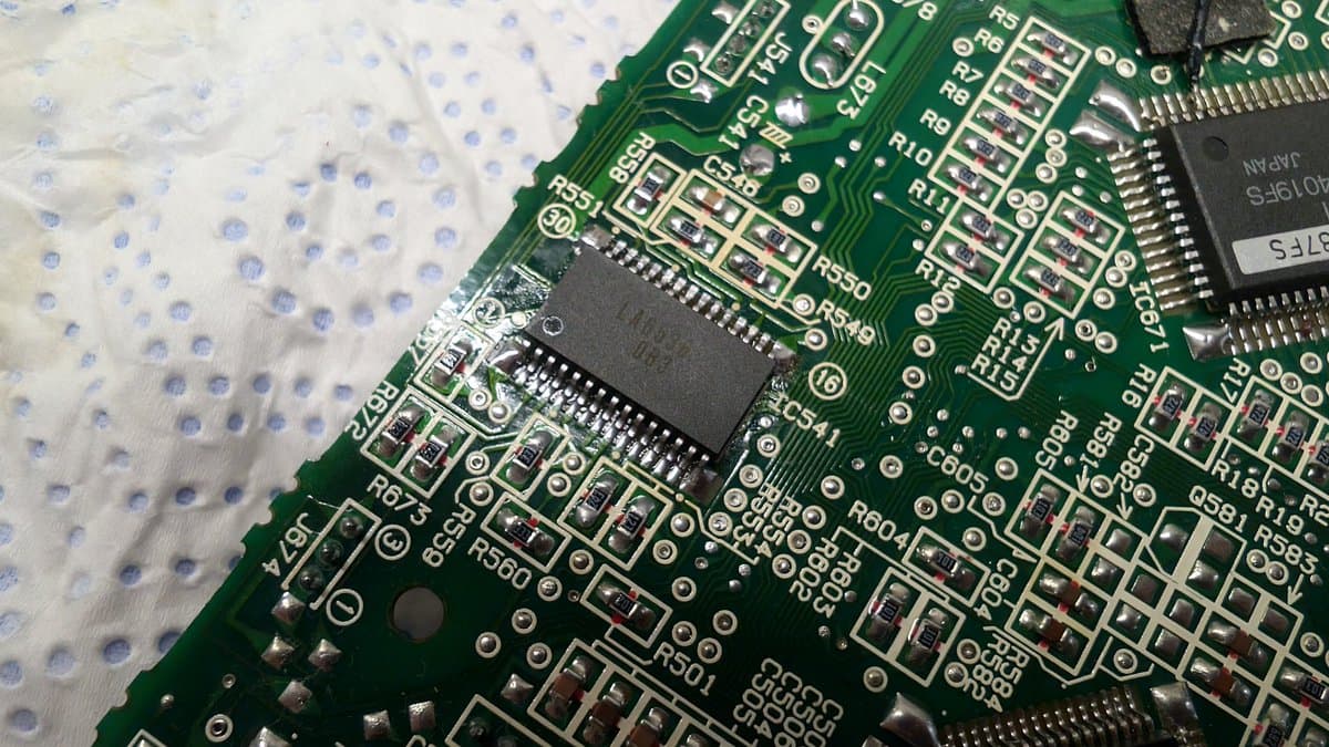 Close-up of Sega Wondermega PCB showing replaced BTL driver IC with surrounding resistor networks and solder joints.